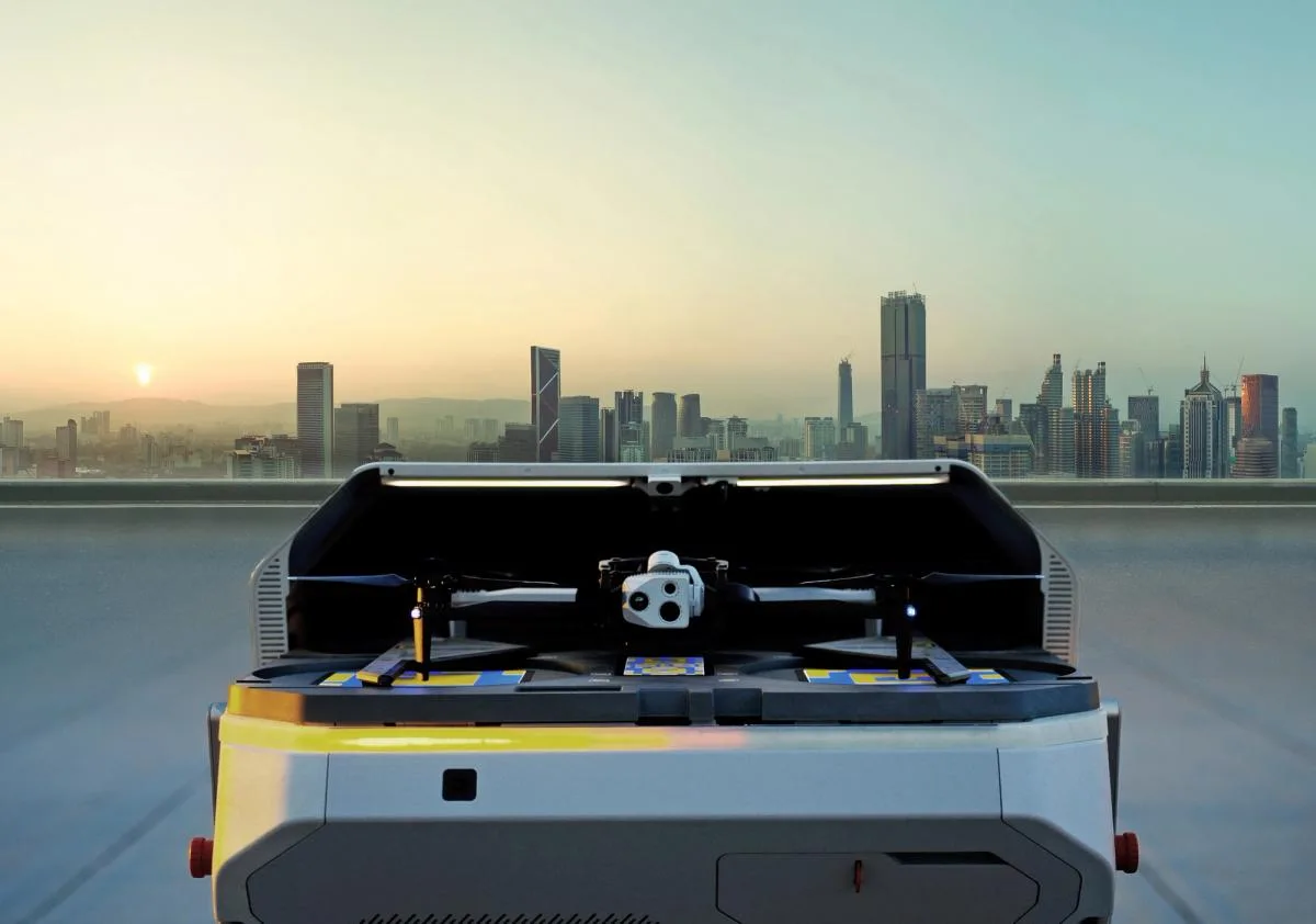 Skydio X10 commercial drone with its attached multi-lens camera, packed in a field case overlooking a city skyline
